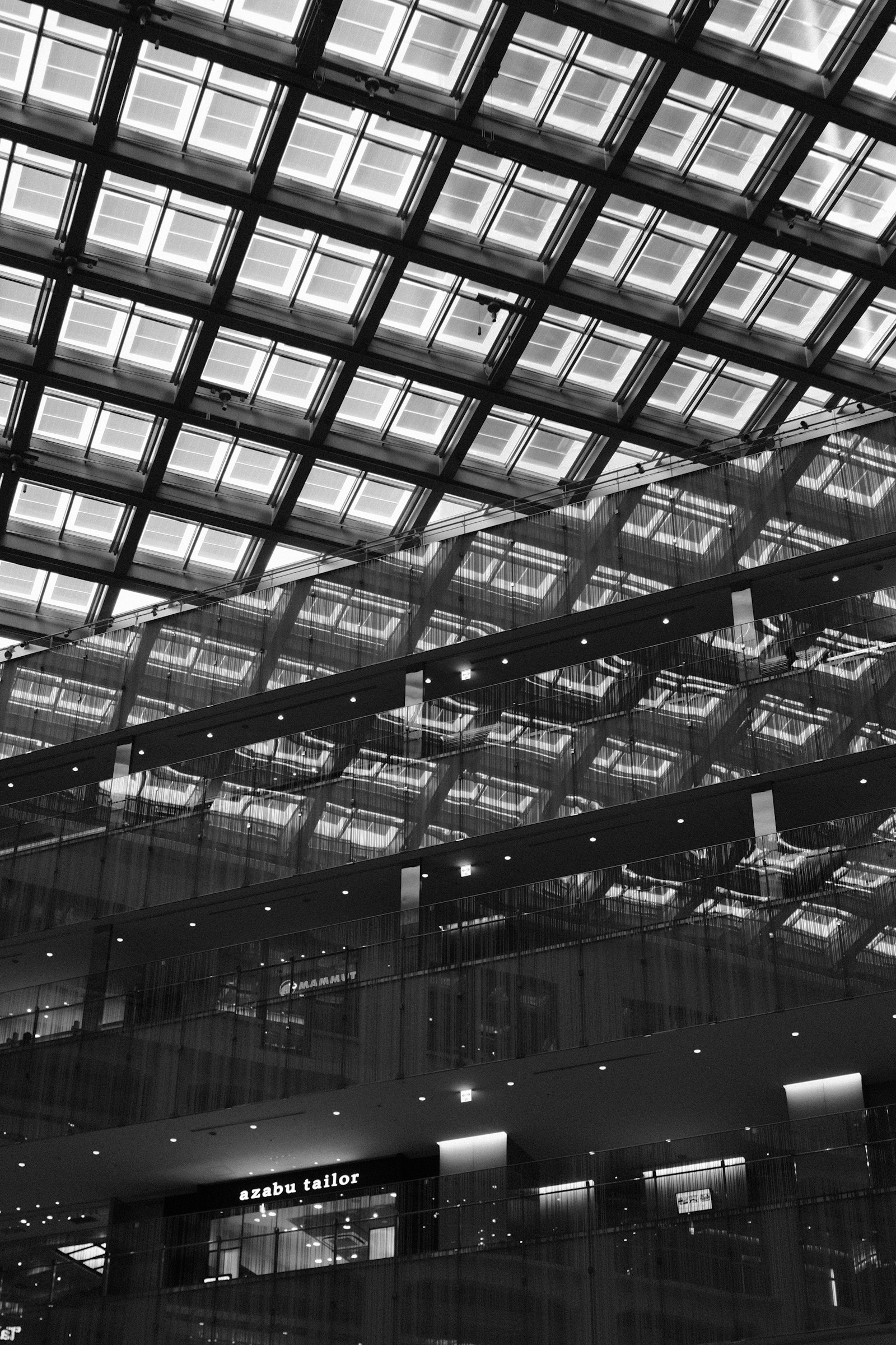 Sculptural glass-ceiling interior of a mixed-use building