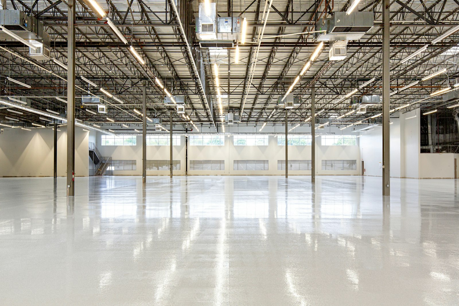 Polished-concrete warehouse interior with high-bay lighting