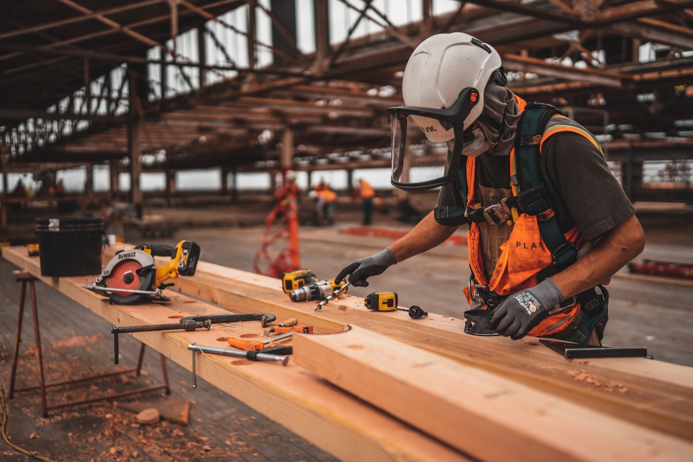 An Avon tradesperson working with a power tool on site