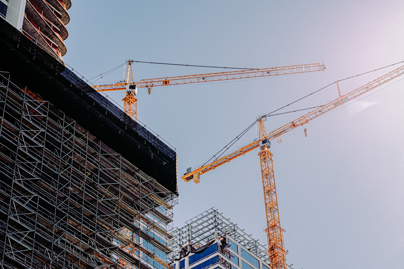 A crane lifting materials on a commercial build